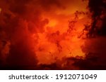 Fantastic concept mystical horror background from another planet from the paranormal world, fantasy style. Dramatic red black orange sky with scary hellish clouds and terrible shadows and light