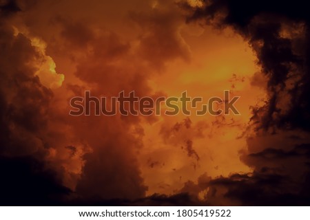 Fantastic concept mystical horror background from another planet from the paranormal world, fantasy style. Dramatic red black orange sky with scary hellish clouds and terrible shadows and light