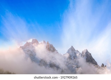 Fantastic Dawn Snow Mountains Landscape Background. Colorful Pink And Blue Clouds Overcast Sky. French Alps, Chamonix Mont-Blanc, France