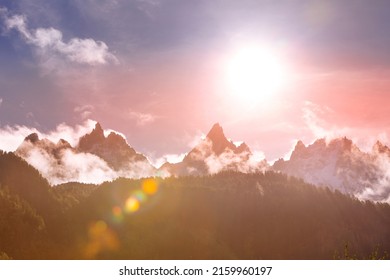 Fantastic Evening Snow Mountains Landscape Background. Colorful Pink And Blue Clouds Overcast Sky. French Alps, Chamonix Mont-Blanc, France