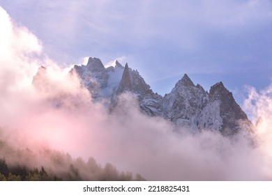 Fantastic Evening Snow Mountains Landscape Background. Colorful Pink And Blue Clouds Overcast Sky. French Alps, Chamonix Mont-Blanc, France