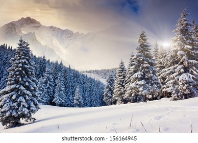 Fantastic evening winter landscape. Dramatic overcast sky. Creative collage. Beauty world. - Shutterstock ID 156164945