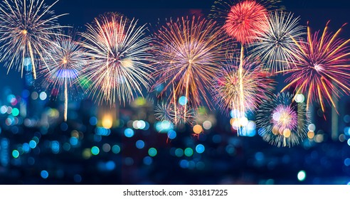 Fantastic Festive New Years Colorful Fireworks On Cityscape Blurred Photo Bokeh In Celebration Night