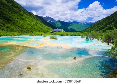 Fantastic lake and forested mountains. Huanglong consists of numerous unique landscapes of geological landforms. Huanglong was declared a World Heritage Site by UNESCO in 1992.