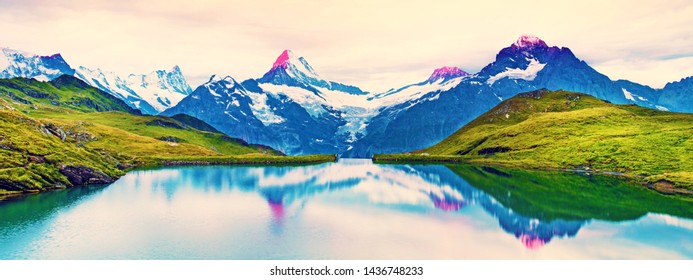 Fantastic Landscape At Sunrise Over The Lake In The Swiss Alps.