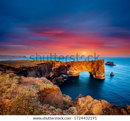 Fantastic large arch of lava in Atlantic Ocean on the coast. Location place Sudurland, cape Dyrholaey, Iceland, Vik village, Europe. Photo of popular tourist attraction. Discover the beauty of earth.