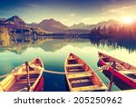 Fantastic mountain lake in National Park High Tatra. Dramatic scenery. Strbske pleso, Slovakia, Europe. Beauty world. Retro style filter. Instagram toning effect.
