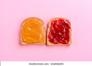Fantastic peanut butter and jelly sandwich, top-view, close-up. Pastel background. American diet.