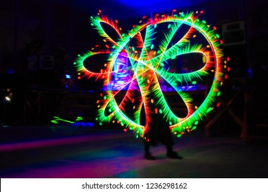 Fantastic Photo Of Flame Man Raver Filmed In Fluorescent Colors With Led Panel That Is Mimicking UV Light.