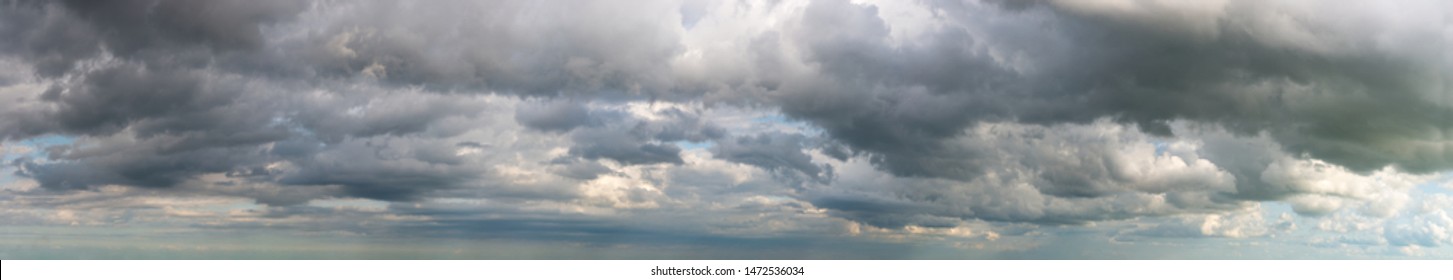 Fantastic soft clouds against blue sky, natural composition - panorama - Shutterstock ID 1472536034