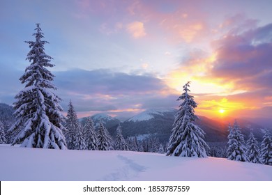 Fantastic sunrise illuminates the mountain. Cold winter morning. Amazing sky with clouds. Wallpaper background. Location place Carpathian, Ukraine, Europe. - Shutterstock ID 1853787559