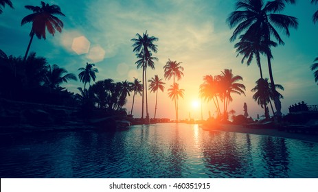 Fantastic sunset at a beach resort in tropics.