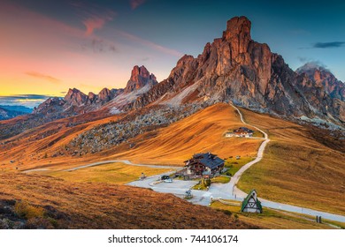 Fantastic sunset landscape, alpine pass and high mountains, Passo Giau with famous Ra Gusela, Nuvolau peaks in background, Dolomites, Italy, Europe