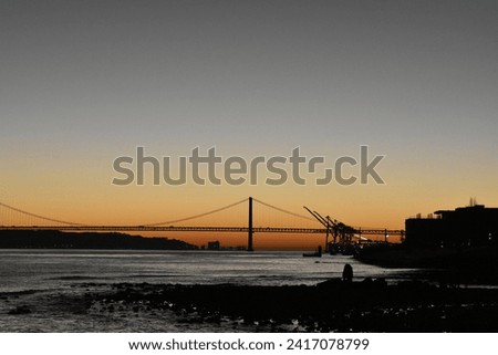 
Fantastic sunset places the 25 de Abril bridge on the horizon, creating a beautiful image