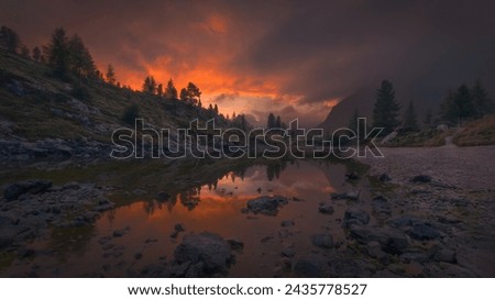 Fantastic view from cute Limides lake near Falzarego Pass at beauttiful sunset in Dolmites, Italy.