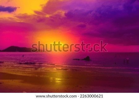 Fantastic view of the dark overcast sky.  Amazing sunset on Patong beach, Phuket. Dramatic and picturesque evening scene.        