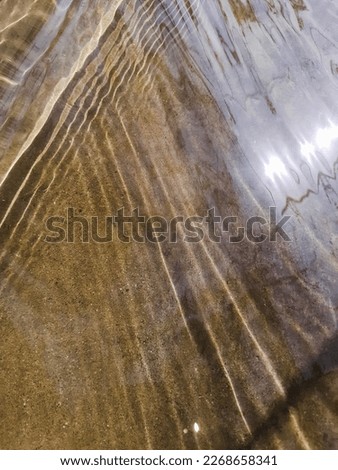 A Fantastic view of fresh, lucent and running water in sun light. 