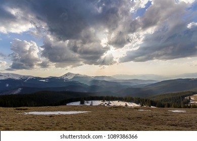 Fantastic view of huge white dark foreboding stormy cloud covering blue sky low over mountains Hoverla and Petros in Carpathian mountains range with bright snow on tops. Beauty and power of nature. - Shutterstock ID 1089386366