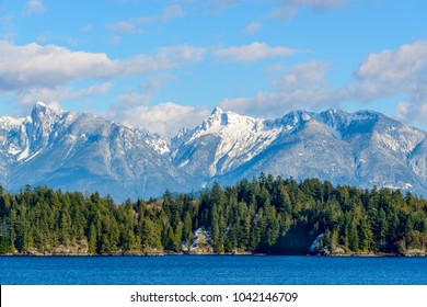 Fantastic view over ocean, snow mountain and rocks at Sechelt inlet in Vancouver, Canada.