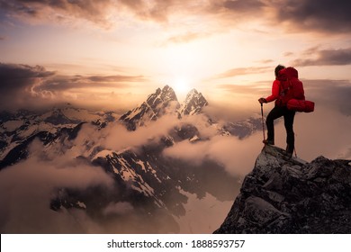 Fantasy Adventure Composite with a Girl on top of a Mountain Cliff with Dramatic Landscape in Background. Landscape from British Columbia, Canada. Dramatic Stormy Sunset Sky.