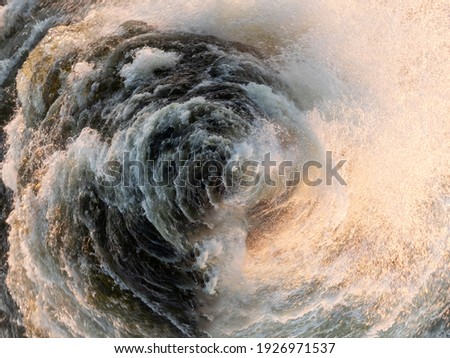 Fantasy of an ancient whirlpool Maelstrom (norv. Malstrøm) that engulfs ships. Water sea swirling spherical background