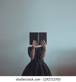 Fantasy book. Minimalist photo. Girl in black dress reads mystical, fantasy book. Black book with deer horns. Mystery story. Vintage outfit. Ring with Moonstone. Minimalism.