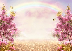 Fantasy Fairy Tale Forest With Blooming Pink Apple Tree Garden And Rainbow In Sky, Enchanted Road Path With Luminous Solar Reflection Sparkles And Flying Butterflies, Nature Landscape Background.