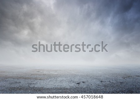 Fantasy gravel background with dramatic sky fog