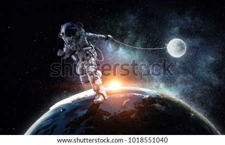 Fantasy image with spaceman catch planet. Mixed media