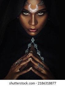 Fantasy Portrait African American Sexy Woman Queen Priestess Of Night. Tiara Crown Silver Moon Hood On Head. Creative Black Design. Voodoo Witch Gothic Girl Sexy Looks Into Camera. Halloween Costume