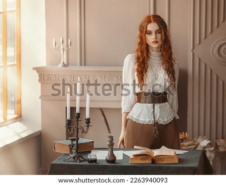 Fantasy portrait Red-haired woman in vintage dress stands in classic room. Clothing old style white blouse. Curly red hair. Redhead girl princess looks at camera beauty face lady writer fashion model
