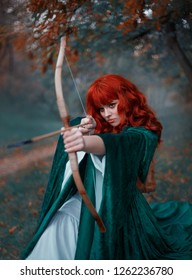 Fantasy Portrait Redhead Woman Archer Holds Bow Hands Directing An Arrow, Princess Hunter, Warlike Image Elf Green Cloak Cape Medieval Clothes White Dress, Art Cold Color Gothic Fog Autumn Tree Forest