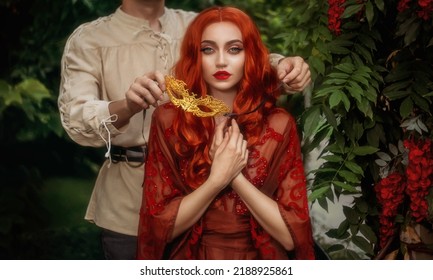 Fantasy Portrait Romantic Couple In Love Man And Woman, Medieval Style Masquerade Ball. Gold Carnival Mask. Red-haired Sexy Girl Lady Queen. Guy King Face Cropped. Vintage White Shirt. Summer Nature