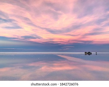 Fantasy sunset soft purple heaven clouds reflection in the tranquil sparkling lake water. Romantic pink twilight at desert night. Magic surreal zen landscape for love. Unique phenomenon Andes nature. - Shutterstock ID 1842726076