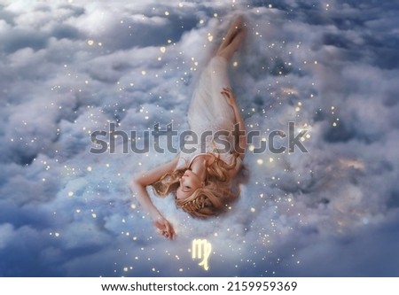 Fantasy woman holy goddess lies dreaming on white clouds, girl in image of zodiac sign Virgo. Astrological symbol horoscope, blue sky heaven, shining stars magical divine light, cosmos universe space.