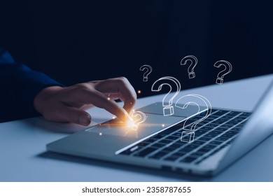FAQ concept, ask questions, find answer online in customer support. Business man use tablet answering customer questions online, Q and A. Online service gives quick answers.
