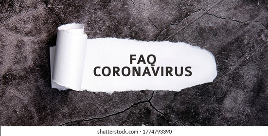 Faq Coronavirus With Torn White Paper On A Gray Concrete Table