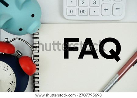 FAQ text written notepad with calculator, piggy bank and alarm clock on white background