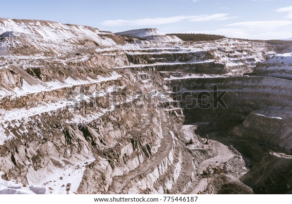in the far north, a deep quarry for minerals, a lot\
of white snow