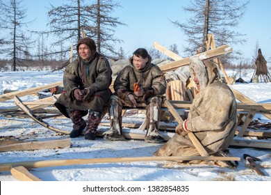 Far north of Yamal, tundra, pasture nord reindeers, family of reindeer herders of the north, father with two sons and a dog - Shutterstock ID 1382854835