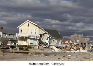 FAR ROCKAWAY, NY - NOVEMBER 4: Destroyed beach house in the aftermath of Hurricane Sandy on November 4, 2012 in Far Rockaway, NY - Shutterstock ID 130759928