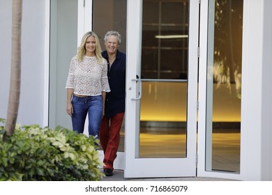 Far Shot Of A Couple Walking Out Of A Building