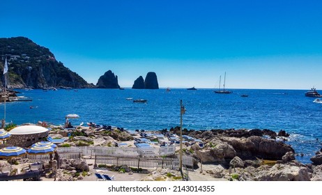 Faraglioni From Marina Piccola Beach In Capri, Italy. Aerial View From Drone