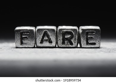 Fare concept. 3d inscription on metal cubes on a gray black background isolated - Shutterstock ID 1918959734