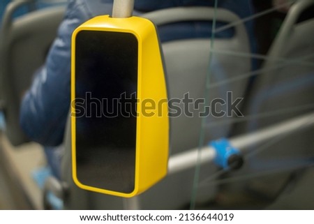 Fare payment device. Yellow reader. NFS label for bank card. Means of fixing ticket.