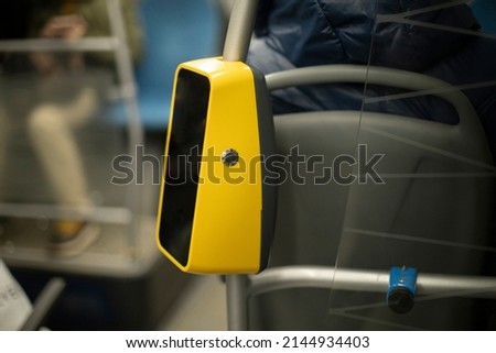 Fare payment device. Yellow reader. NFS label for bank card. Means of fixing ticket.