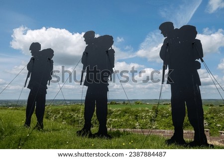 Fareham England - May 17 2023: Silhouetted figures at Standing with Giants a tribute to those who lost their lives in the Falklands Conflict