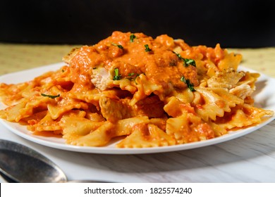 Farfalle Bow Tie Pasta In Creamy Vodka Tomato Sauce With Grilled Chicken And Green Peas