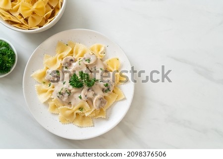 farfalle pasta with mushroom white cream sauce - Italian food style
