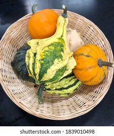 Fargo North Dakota/USA, September 27, 2020, A Basket Full With Decorative Pumpkins And Gourds With Black Background.